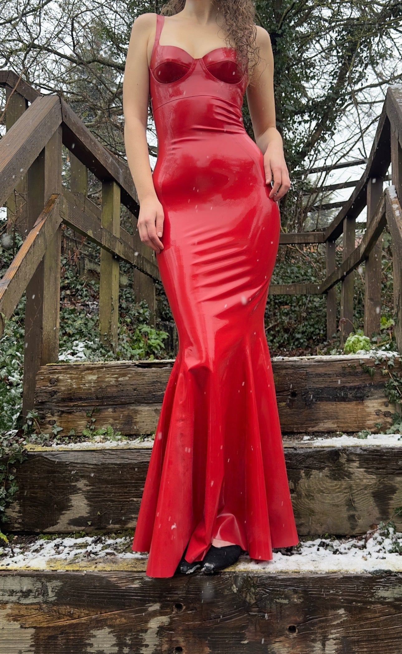 Elegant high-shine latex dress with cupped mermaid gown silhouette highlighting natural curves